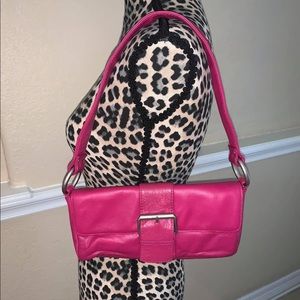 Fuchsia Wilson’s Leather Maxima clutch purse.